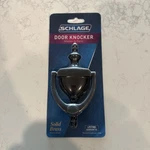 Schlage SC2-3125-716 5-5/16-INCH Solid Brass Door Knocker, Aged Bronze. Fixed Price $19.99.