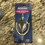 Schlage Door Knocker, Small 6"X3", Solid Brass, Satin Nickel, Model SC2-3125-619. Fixed Price $13.99.