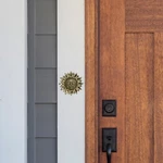 Sunface Doorbell Ringer By Michael Healy - Bronze Finish. Fixed Price $20.00.