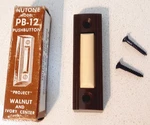 Vintage Nutone Push Button Doorbell Model PB-12 Walnut Ivory Center Nos. Fixed Price $9.95.